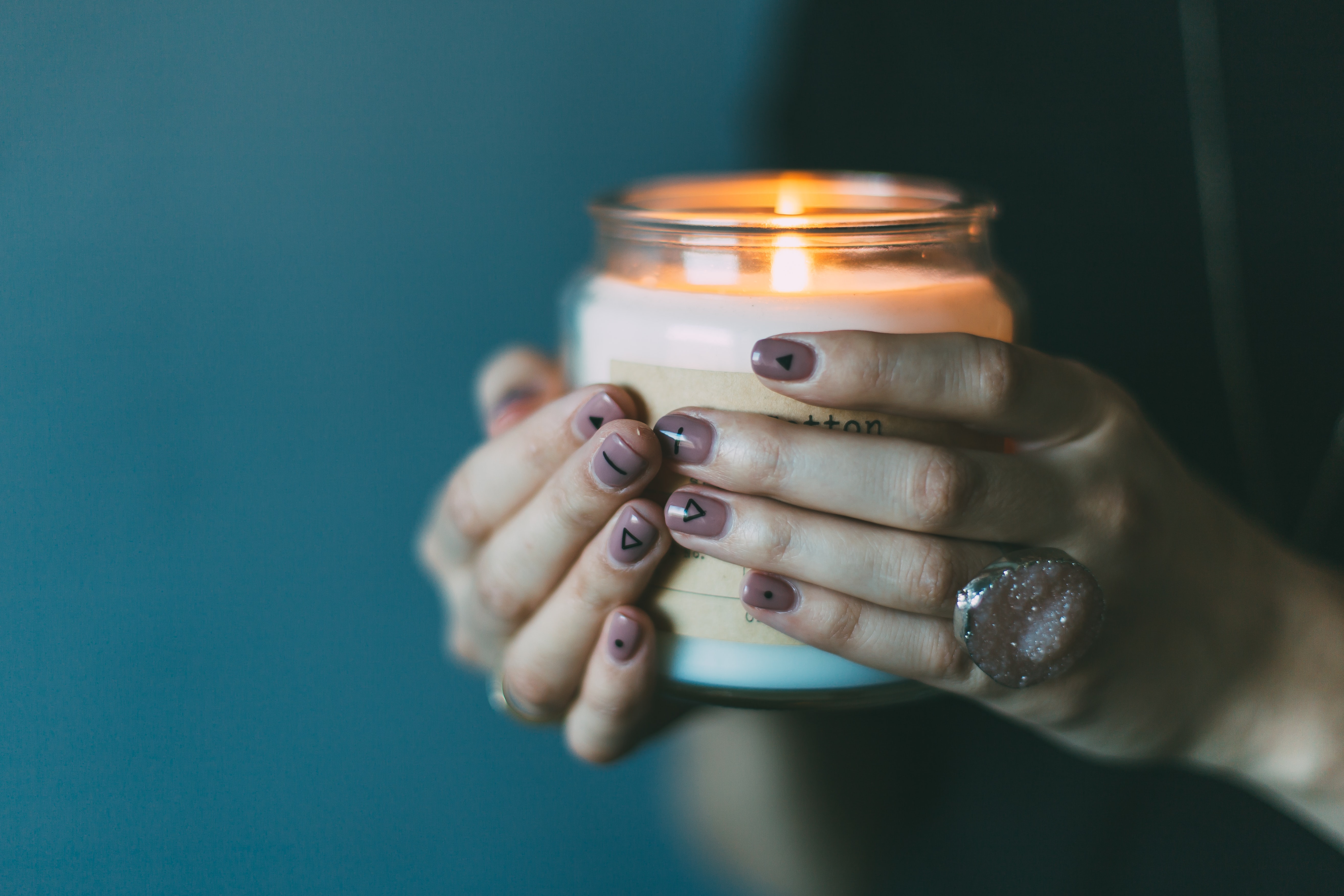 hands holding candle